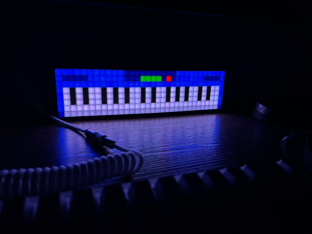 LED display prototype lit up in a dark room.